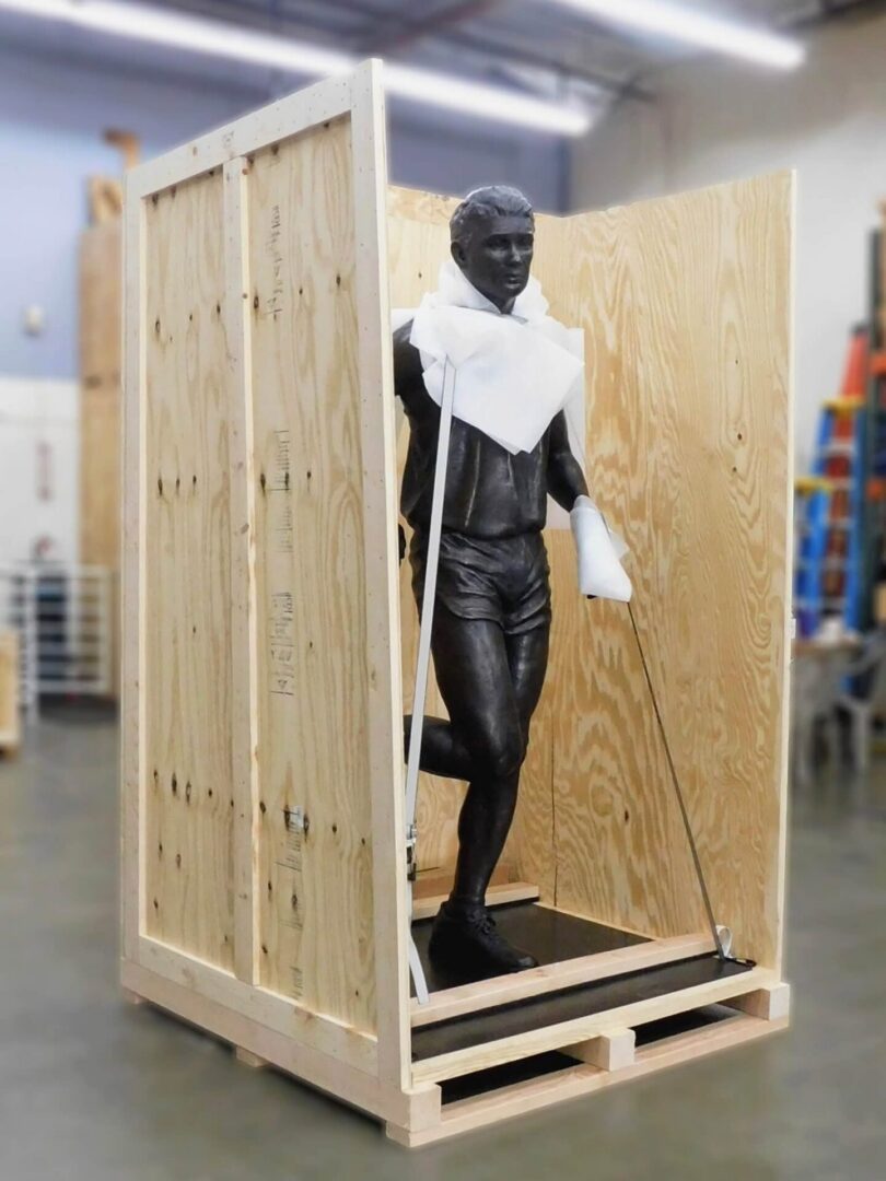 Crate with a sculpture inside.